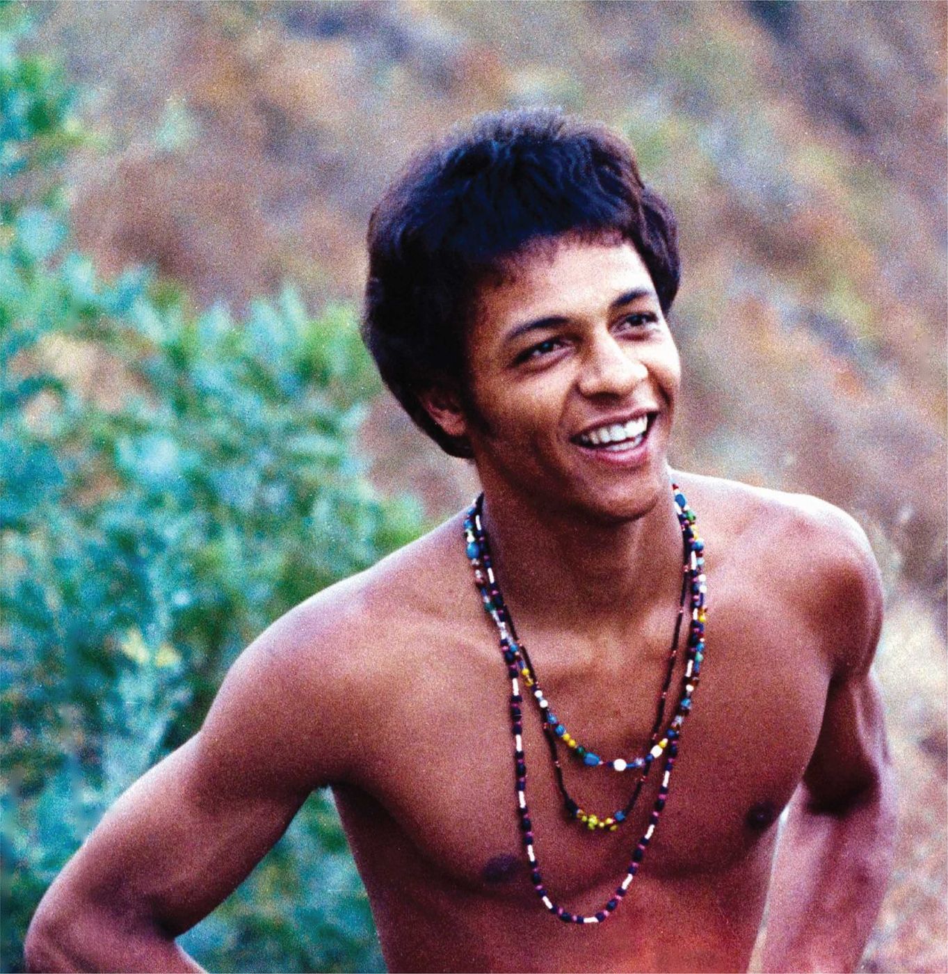 Arthur Lee of Love smiling outdoors