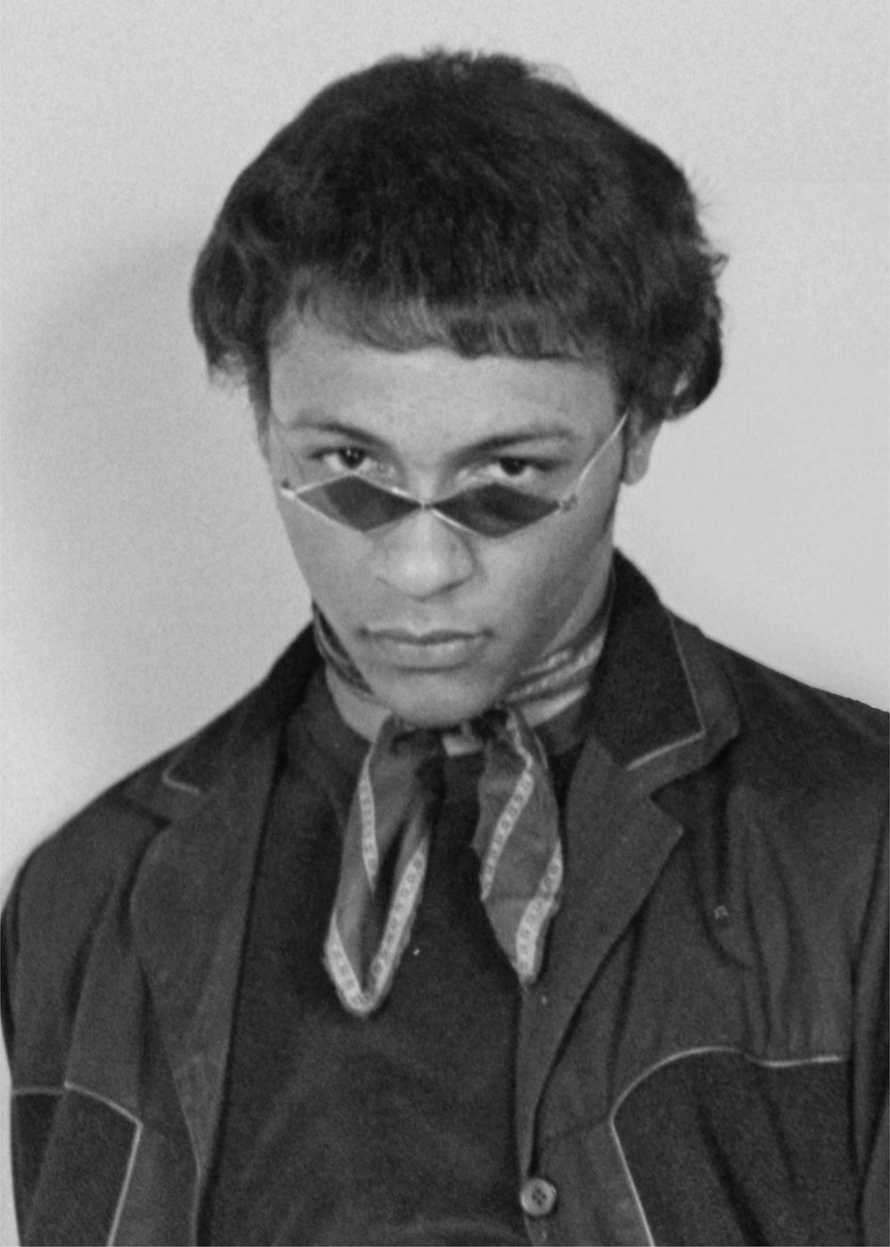 Arthur Lee wearing round sunglasses